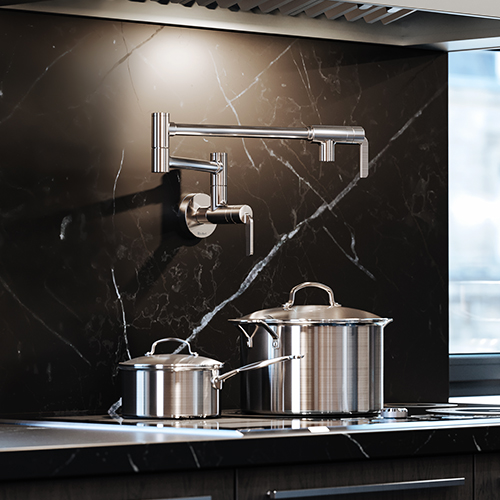 A dark modern kitchen featuring a chrome pot filler.